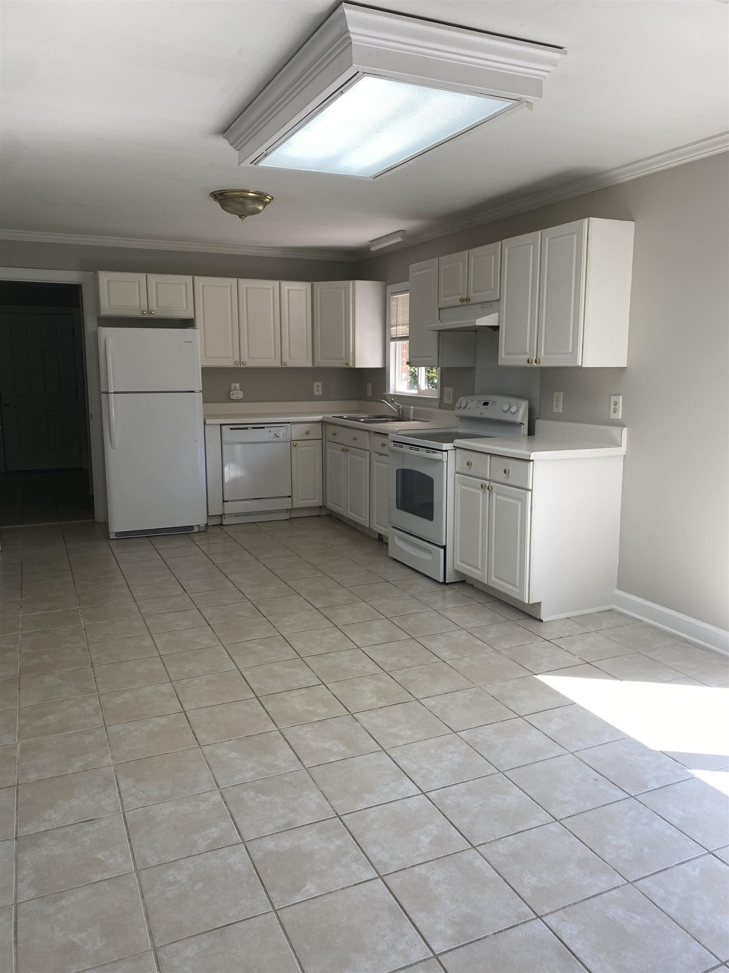 633 Buck Jones Road Raleigh, NC 27606 - Photo 8 of 20 a kitchen with cabinets and white appliances
