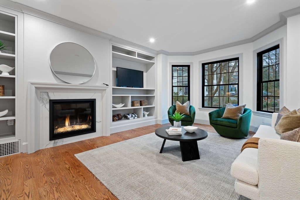 8 Stetson Street Brookline, MA 02446 - Photo 12 of 36 a living room with furniture and a fireplace