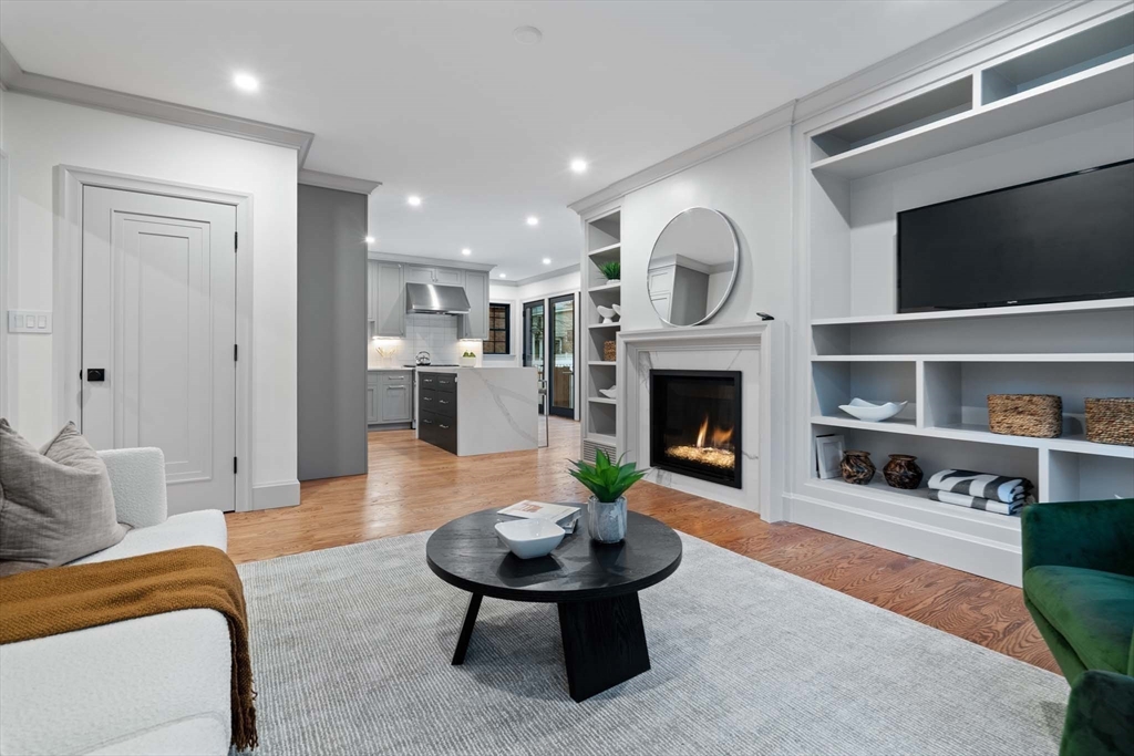 8 Stetson Street Brookline, MA 02446 - Photo 13 of 36 a living room with furniture and a fireplace