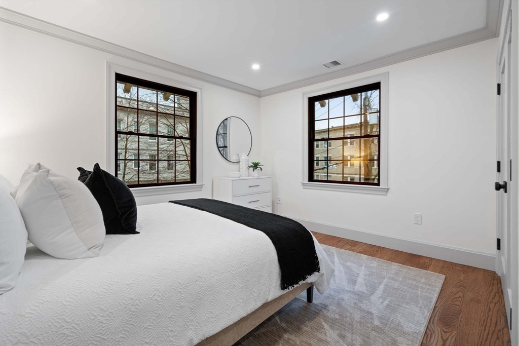 8 Stetson Street Brookline, MA 02446 - Photo 17 of 36 a bedroom with a bed next to a window