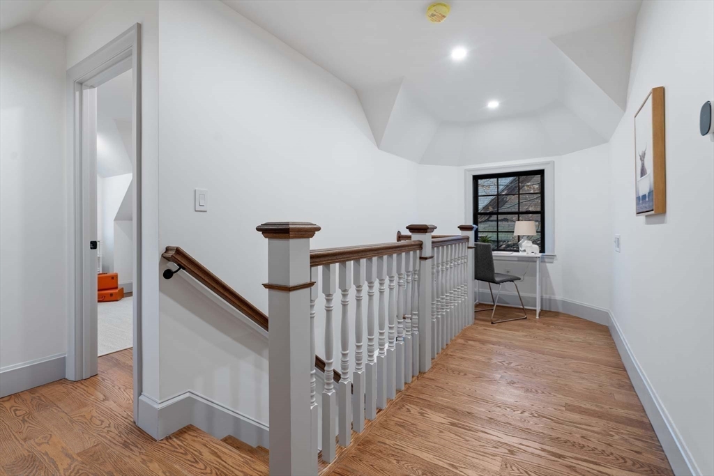 8 Stetson Street Brookline, MA 02446 - Photo 20 of 36 a view of a hallway with wooden floor and staircase