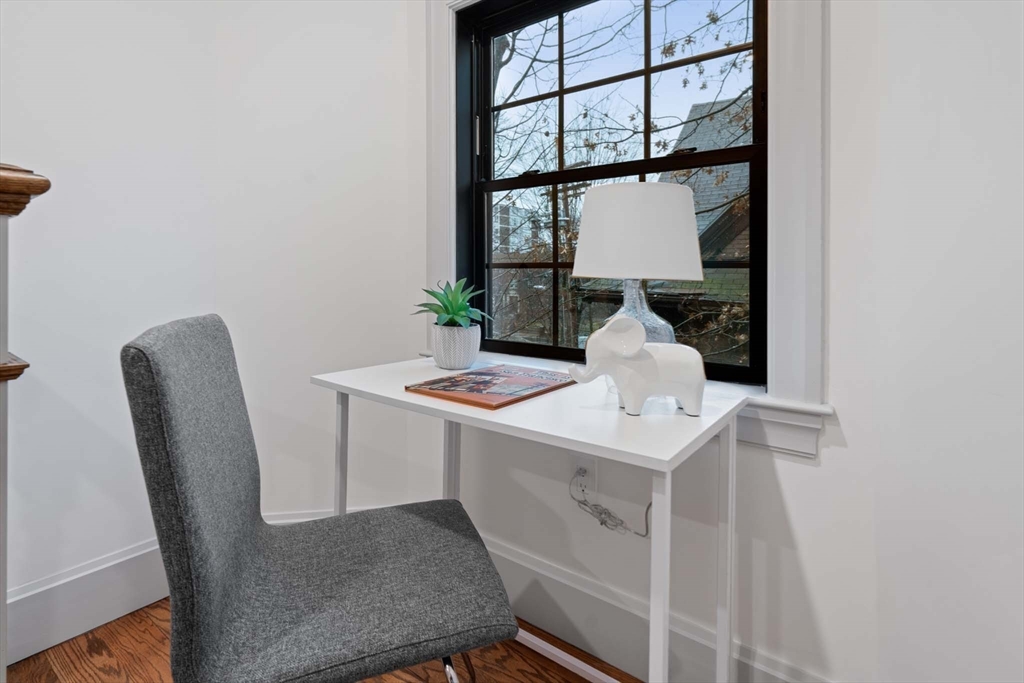 8 Stetson Street Brookline, MA 02446 - Photo 21 of 36 a dining room with a table and chairs