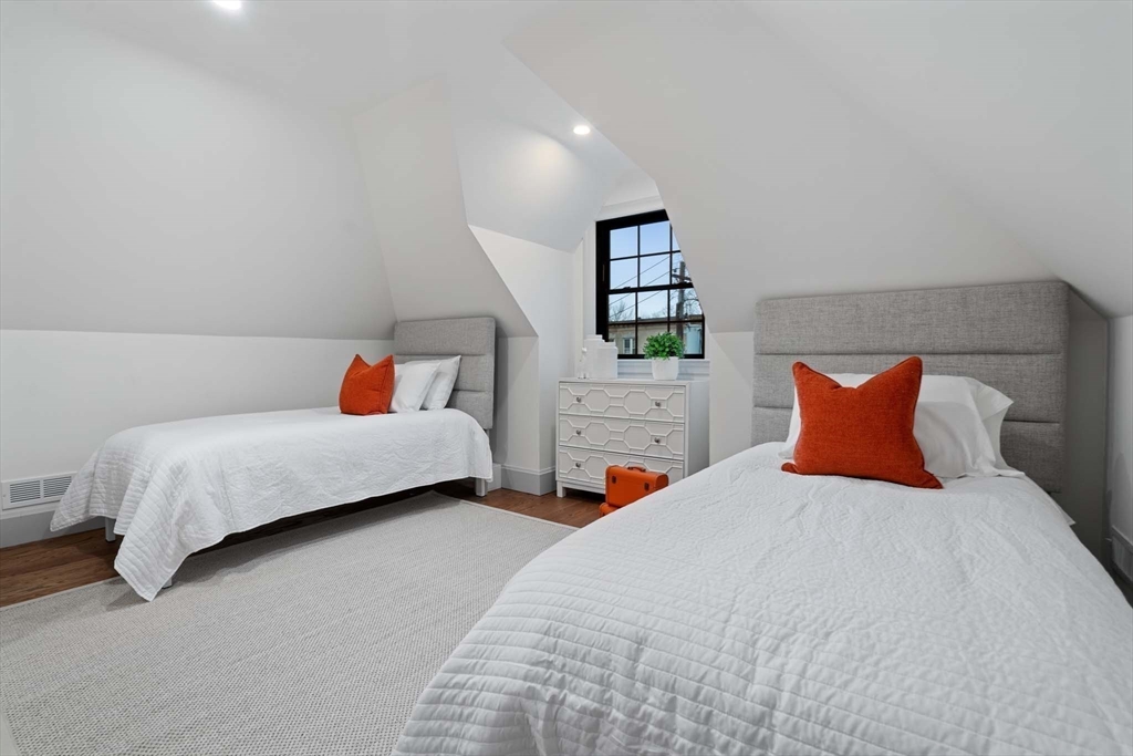 8 Stetson Street Brookline, MA 02446 - Photo 22 of 36 a bedroom with two beds and painting on the wall
