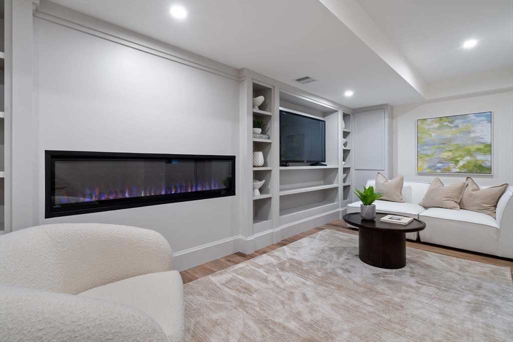 8 Stetson Street Brookline, MA 02446 - Photo 23 of 36 a living room with furniture and a flat screen tv