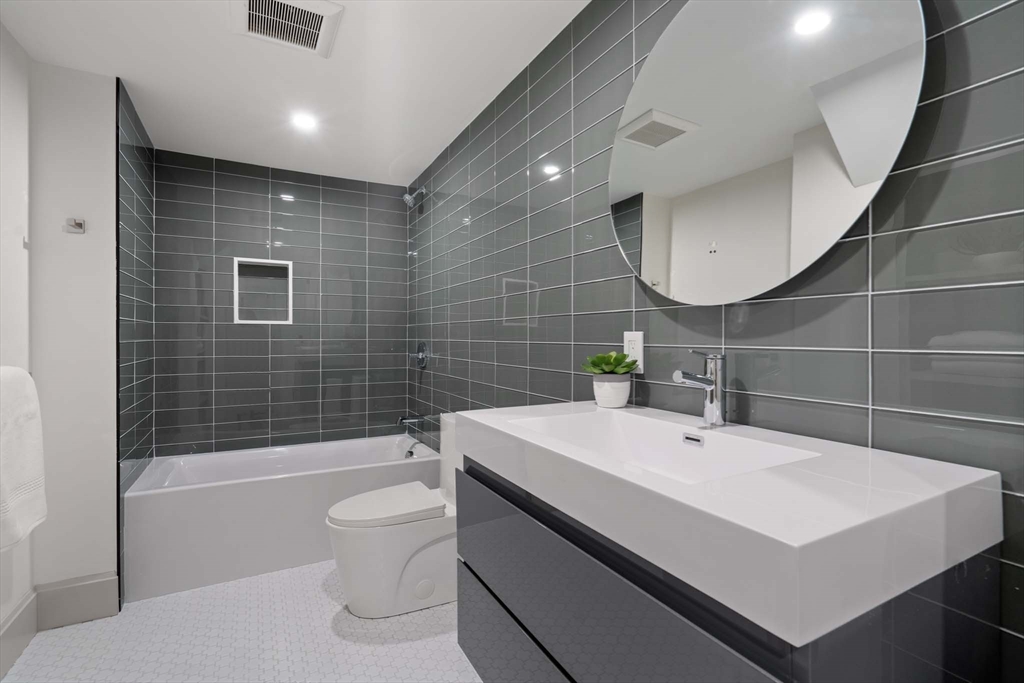 8 Stetson Street Brookline, MA 02446 - Photo 26 of 36 a bathroom with a sink a toilet and shower