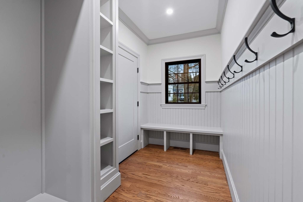8 Stetson Street Brookline, MA 02446 - Photo 27 of 36 a view of an empty room with wooden floor and a window