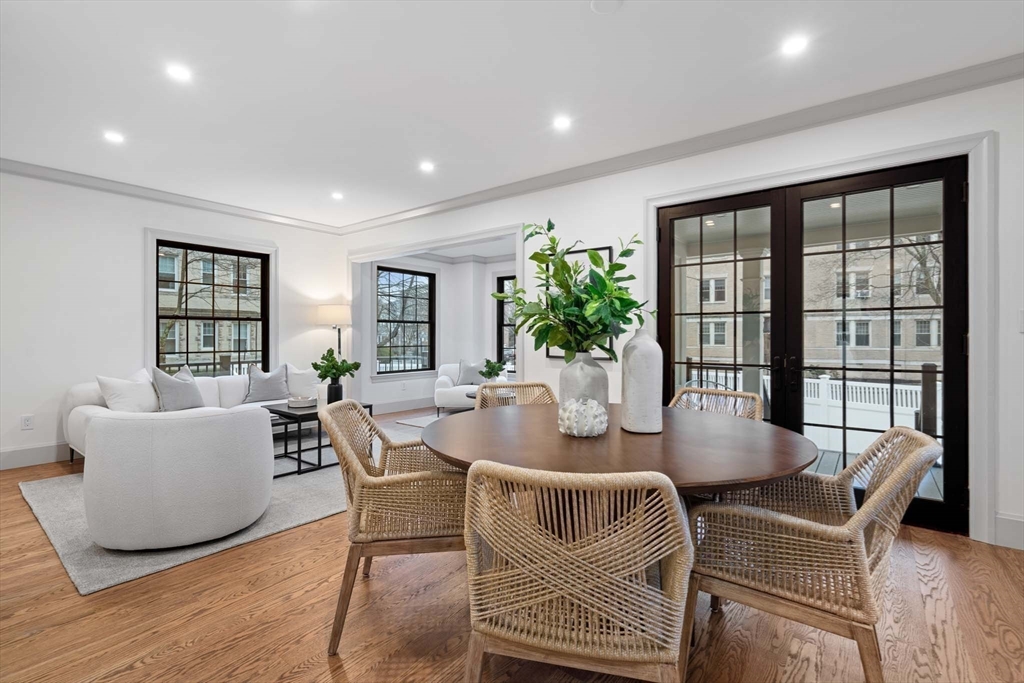 8 Stetson Street Brookline, MA 02446 - Photo 8 of 36 a dining room with furniture potted plants and wooden floor