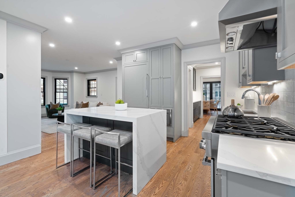 8 Stetson Street Brookline, MA 02446 - Photo 10 of 36 a kitchen with a table and chairs in it