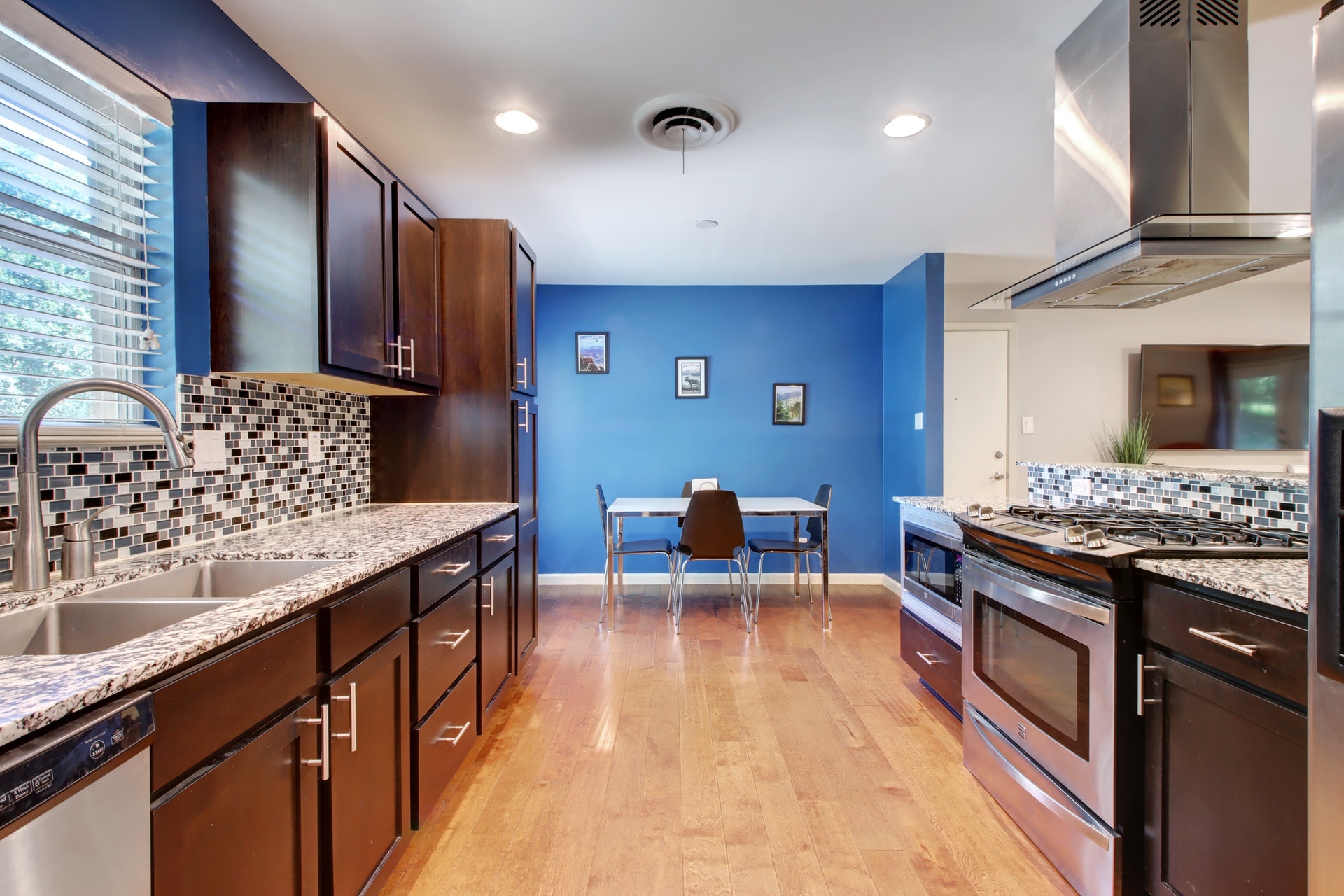 6709 Columbia Drive Austin, TX 78723 - Photo 11 of 24 a kitchen with stainless steel appliances granite countertop a sink stove and refrigerator