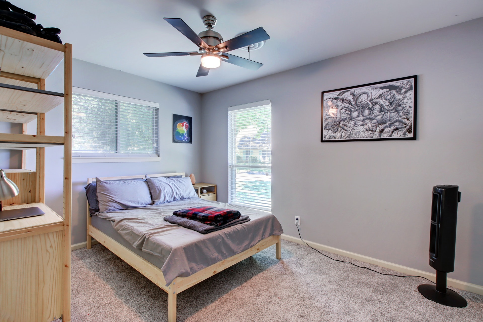 6709 Columbia Drive Austin, TX 78723 - Photo 21 of 24 a bedroom with a bed and a chandelier