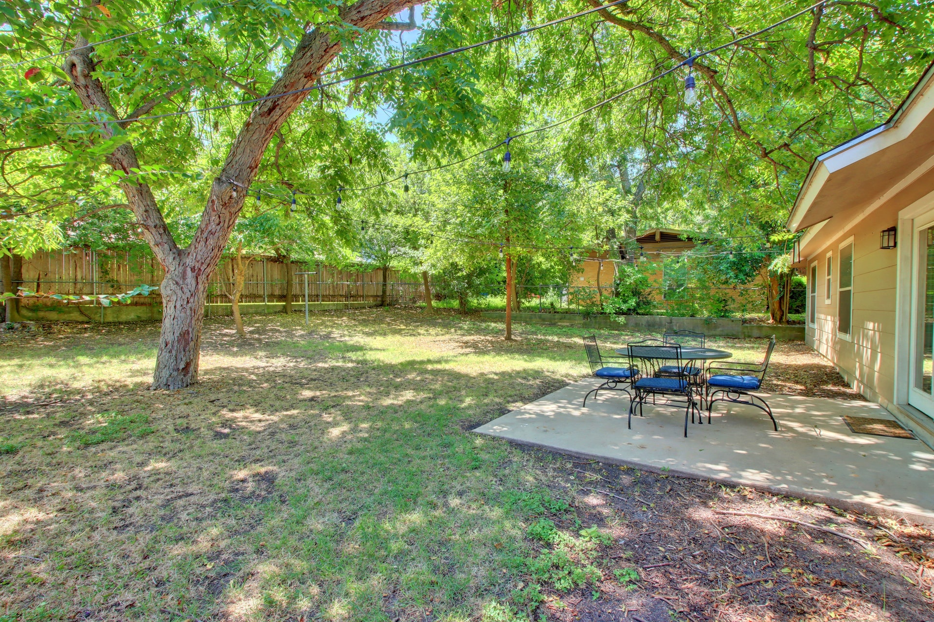 6709 Columbia Drive Austin, TX 78723 - Photo 23 of 24 a view of a backyard with a table and chairs