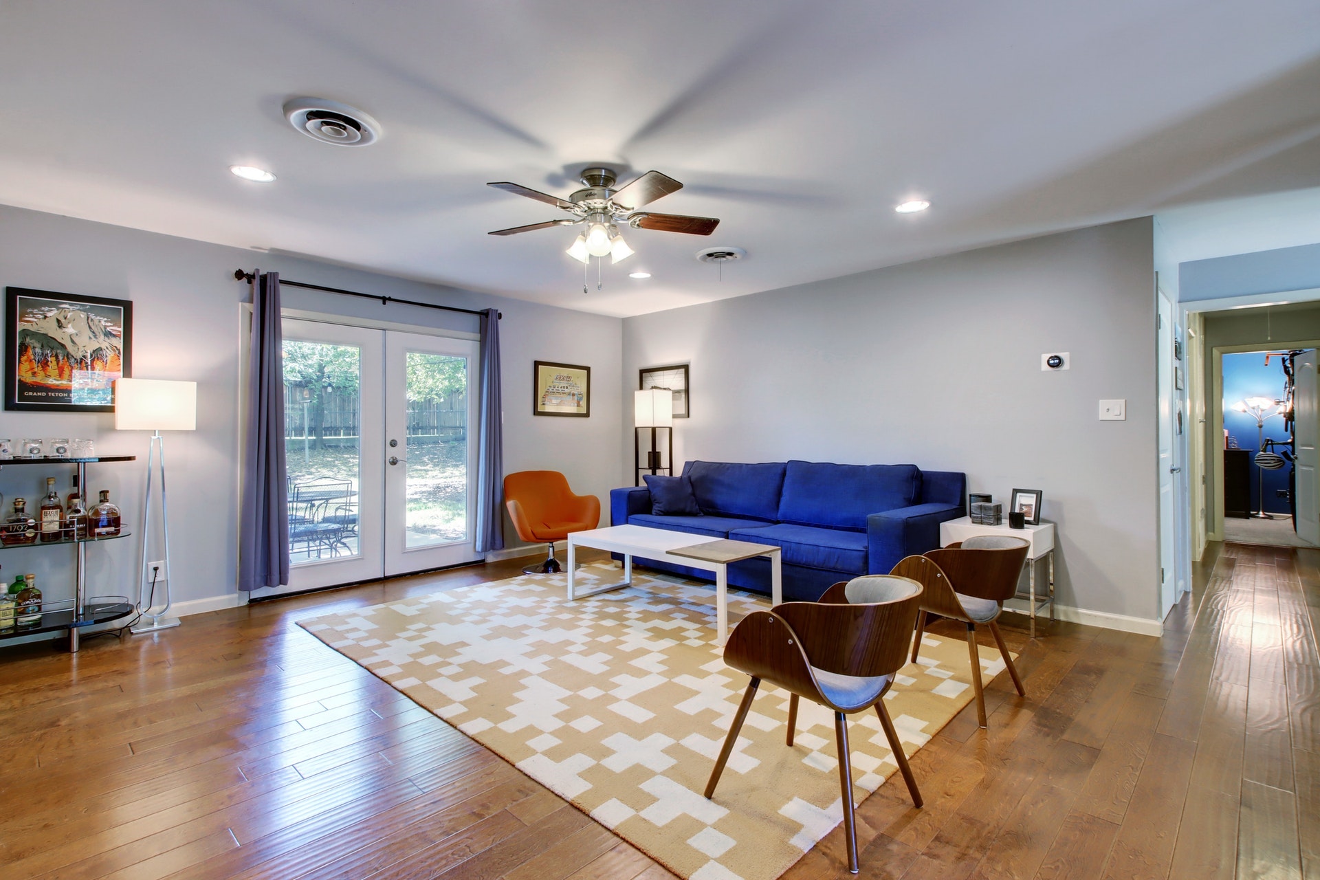 6709 Columbia Drive Austin, TX 78723 - Photo 6 of 24 a living room with furniture a flat screen tv and wooden floor