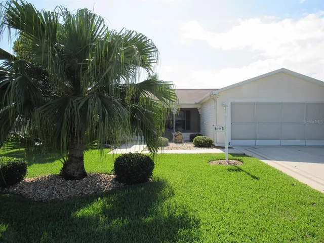 a backyard of a house with seating space