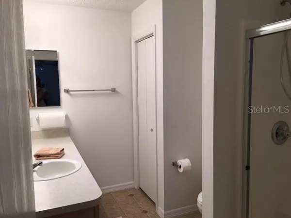 a bathroom with a sink and toilet