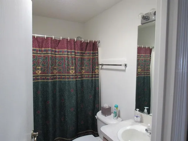 a bathroom with a sink and mirror