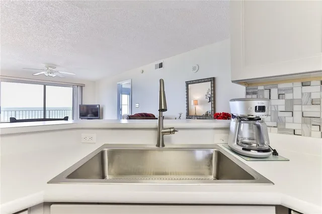 a kitchen with a stove and a microwave