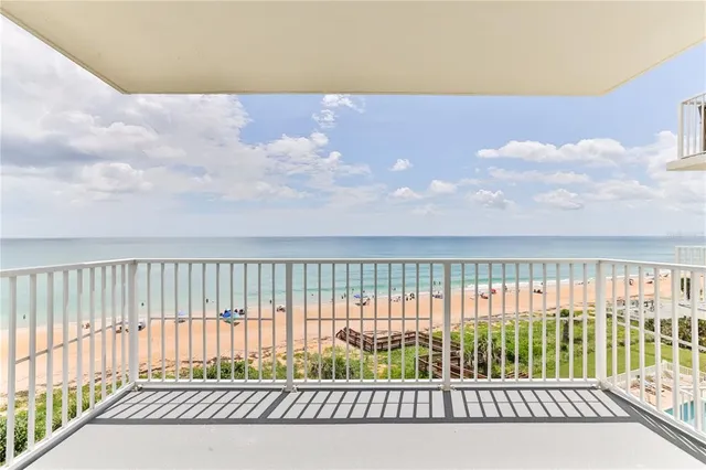 a view of a hallway with windows