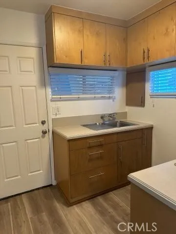 a kitchen with a sink and cabinets