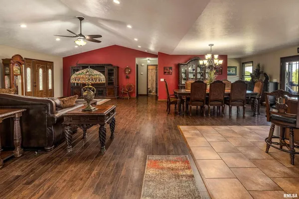 a view of a dining room with furniture and chandelier