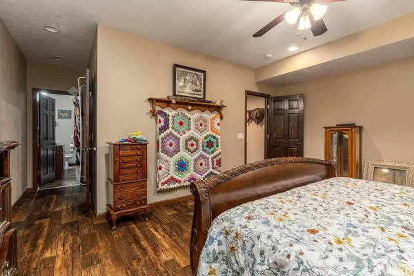 a bedroom with a bed and a chandelier