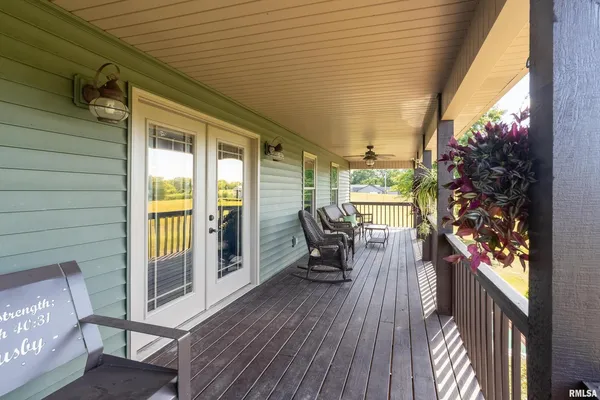 a porch with wooden floor