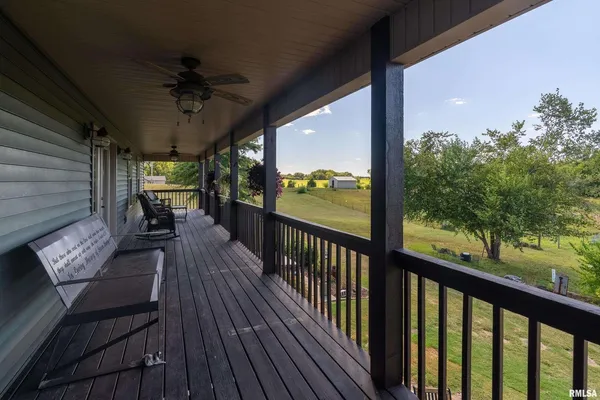 a view of a balcony with furniture