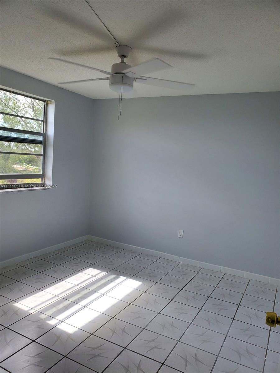 14250 Southwest 62nd Street, Unit 505 Miami, FL 33183 - Photo 15 of 38 a view of an empty room and window