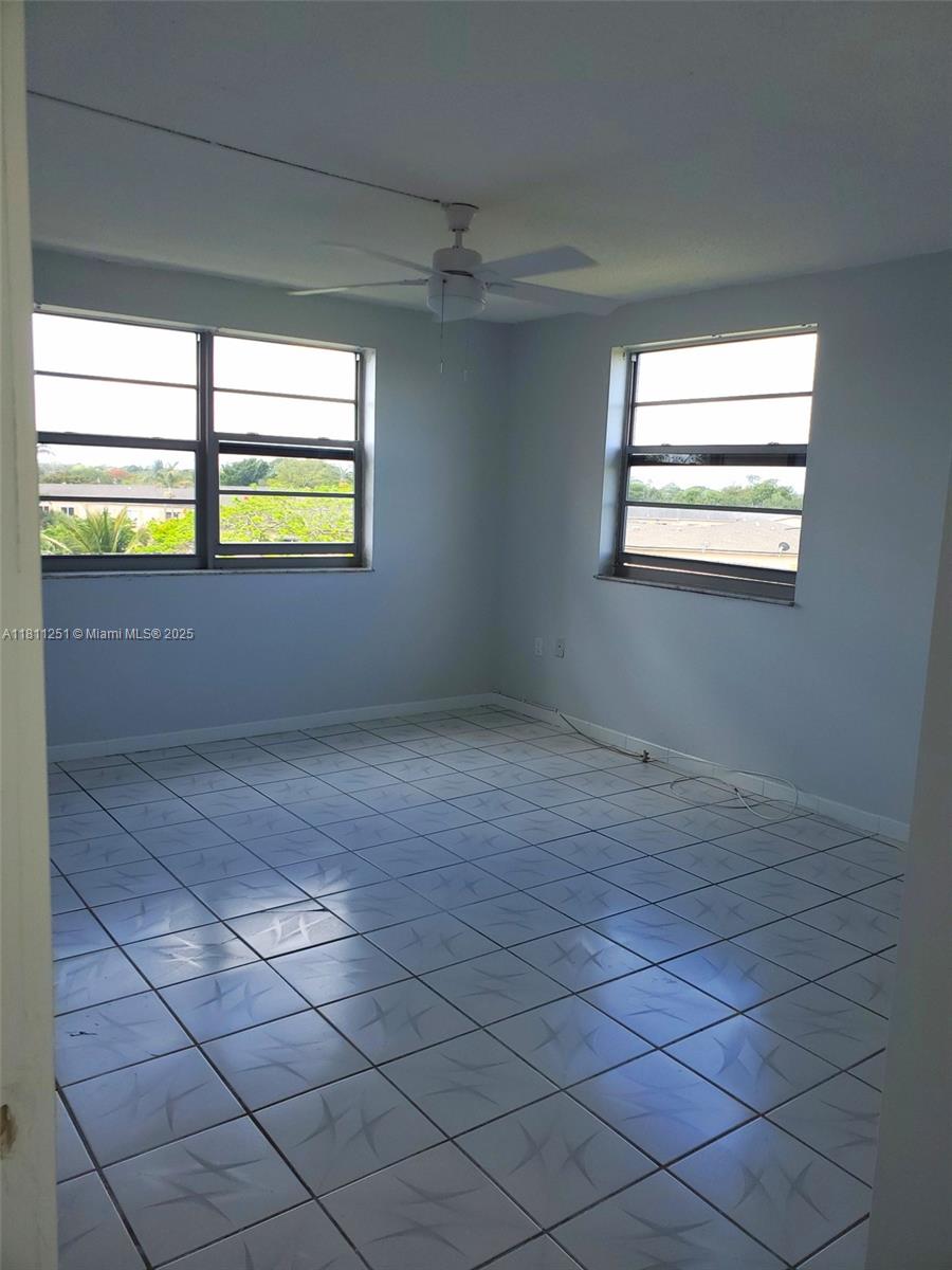 14250 Southwest 62nd Street, Unit 505 Miami, FL 33183 - Photo 17 of 38 en empty room with windows