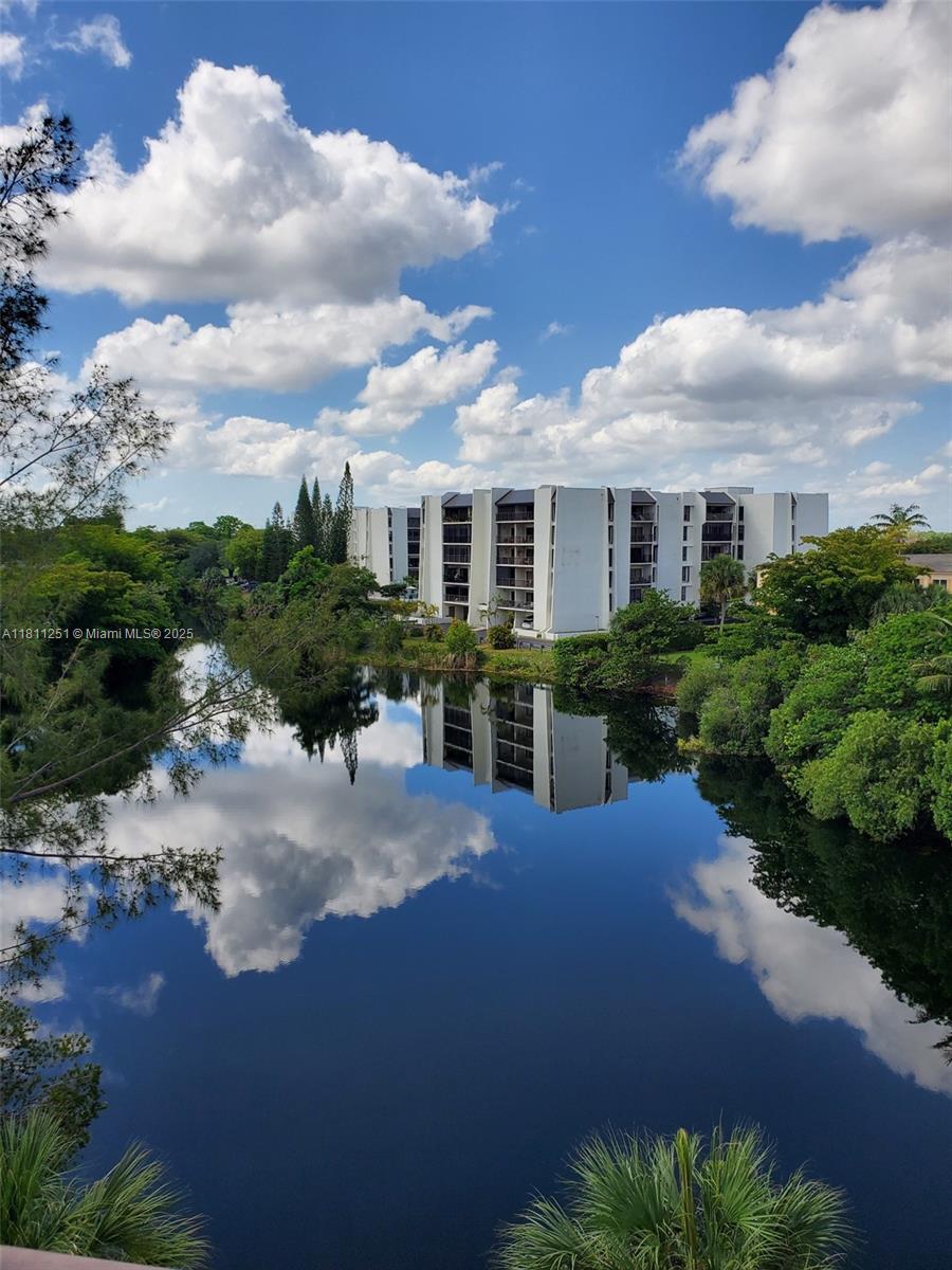 14250 Southwest 62nd Street, Unit 505 Miami, FL 33183 - Photo 2 of 38 a view of a house with a yard