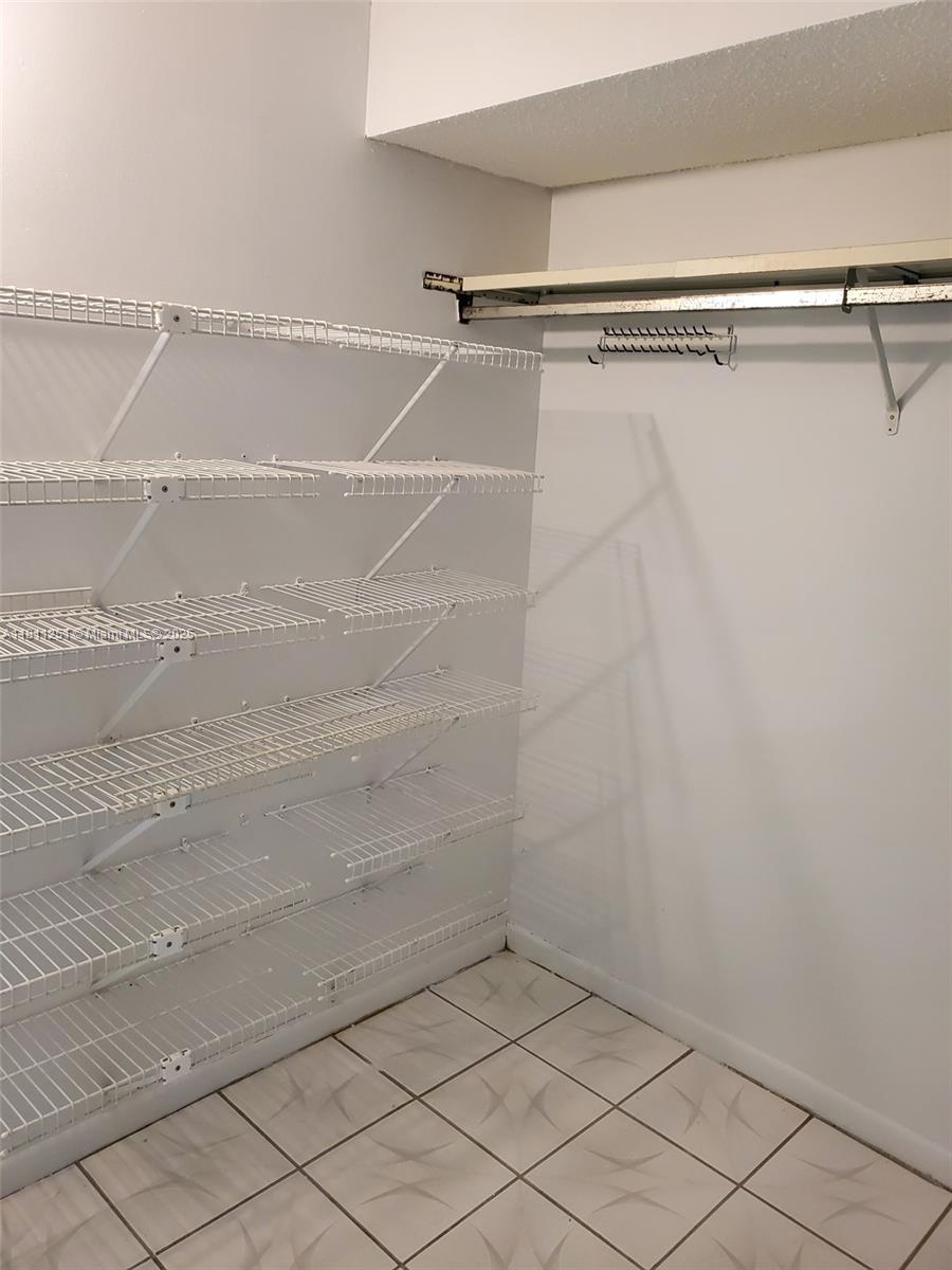 14250 Southwest 62nd Street, Unit 505 Miami, FL 33183 - Photo 22 of 38 a view of a room with racks on the wall
