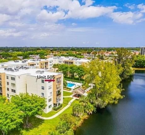 14250 Southwest 62nd Street, Unit 505 Miami, FL 33183 - Photo 30 of 38 a view of a lake with a building in the background