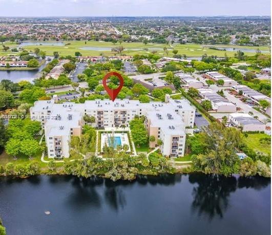 14250 Southwest 62nd Street, Unit 505 Miami, FL 33183 - Photo 33 of 38 an aerial view of lake and residential houses with outdoor space