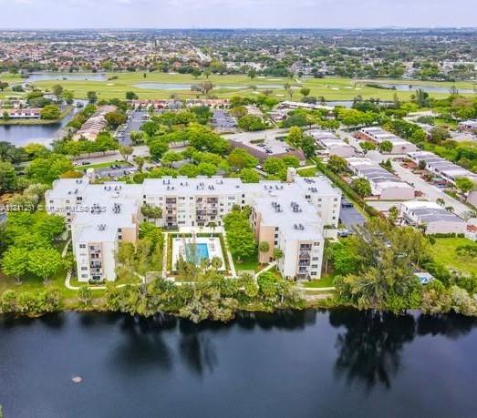 14250 Southwest 62nd Street, Unit 505 Miami, FL 33183 - Photo 35 of 38 an aerial view of residential houses with outdoor space and lake view