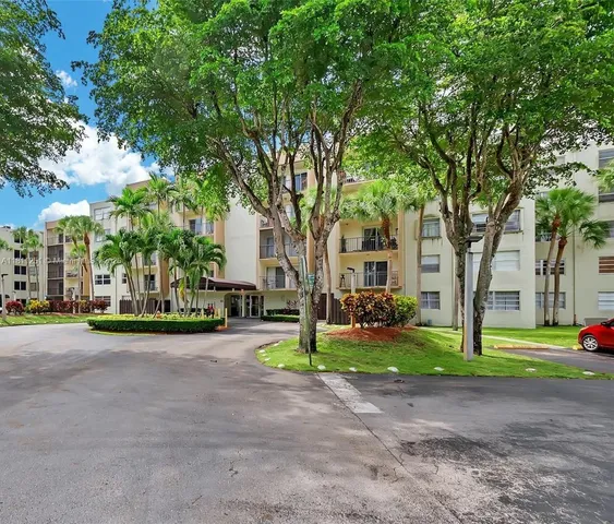 a view of a trees in front of a house
