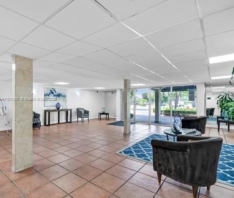 14250 Southwest 62nd Street, Unit 505 Miami, FL 33183 - Photo 6 of 38 a living room with furniture and a large window