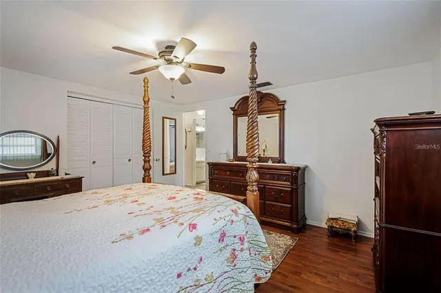 a bedroom with a bed and a dresser