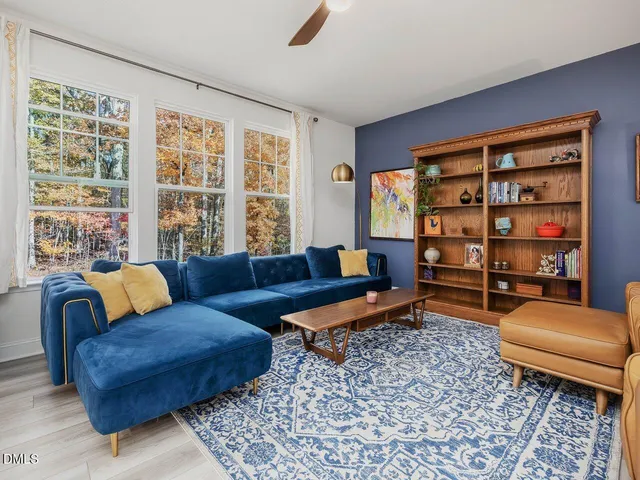 a living room with furniture and a rug
