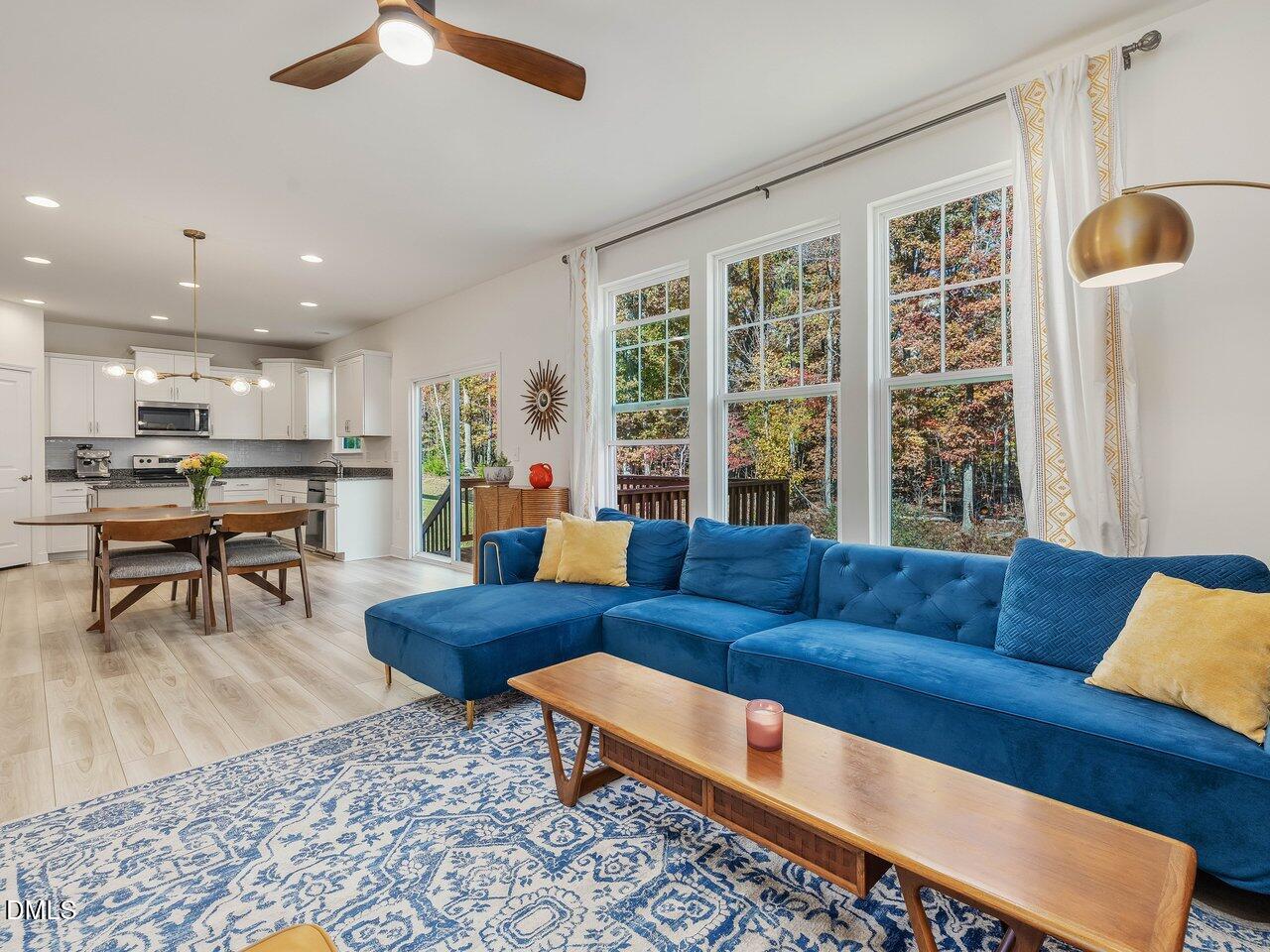 718 Heartpine Drive Mebane, NC 27302 - Photo 20 of 62 a living room with furniture and a large window