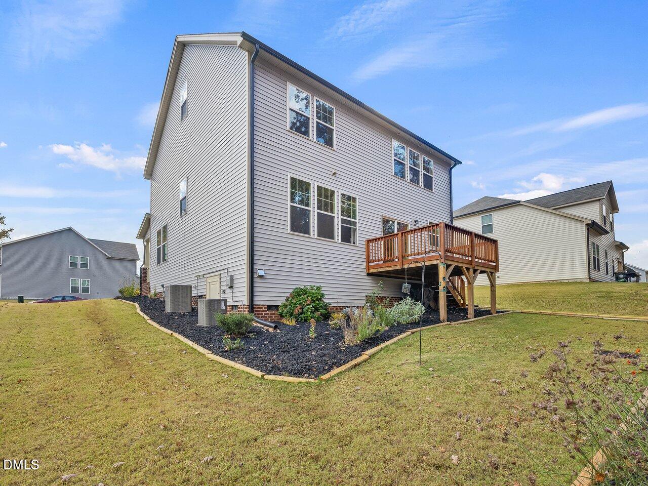 718 Heartpine Drive Mebane, NC 27302 - Photo 24 of 62 a front view of a house with a yard