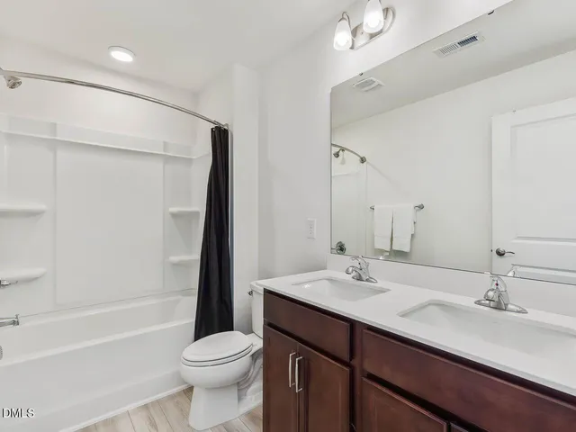 a bedroom with a bed and lamp