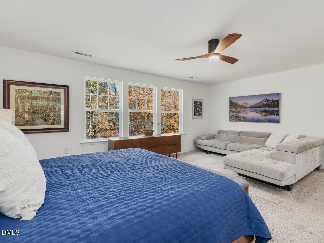 718 Heartpine Drive Mebane, NC 27302 - Photo 35 of 62 a spacious bedroom with two beds and a large window