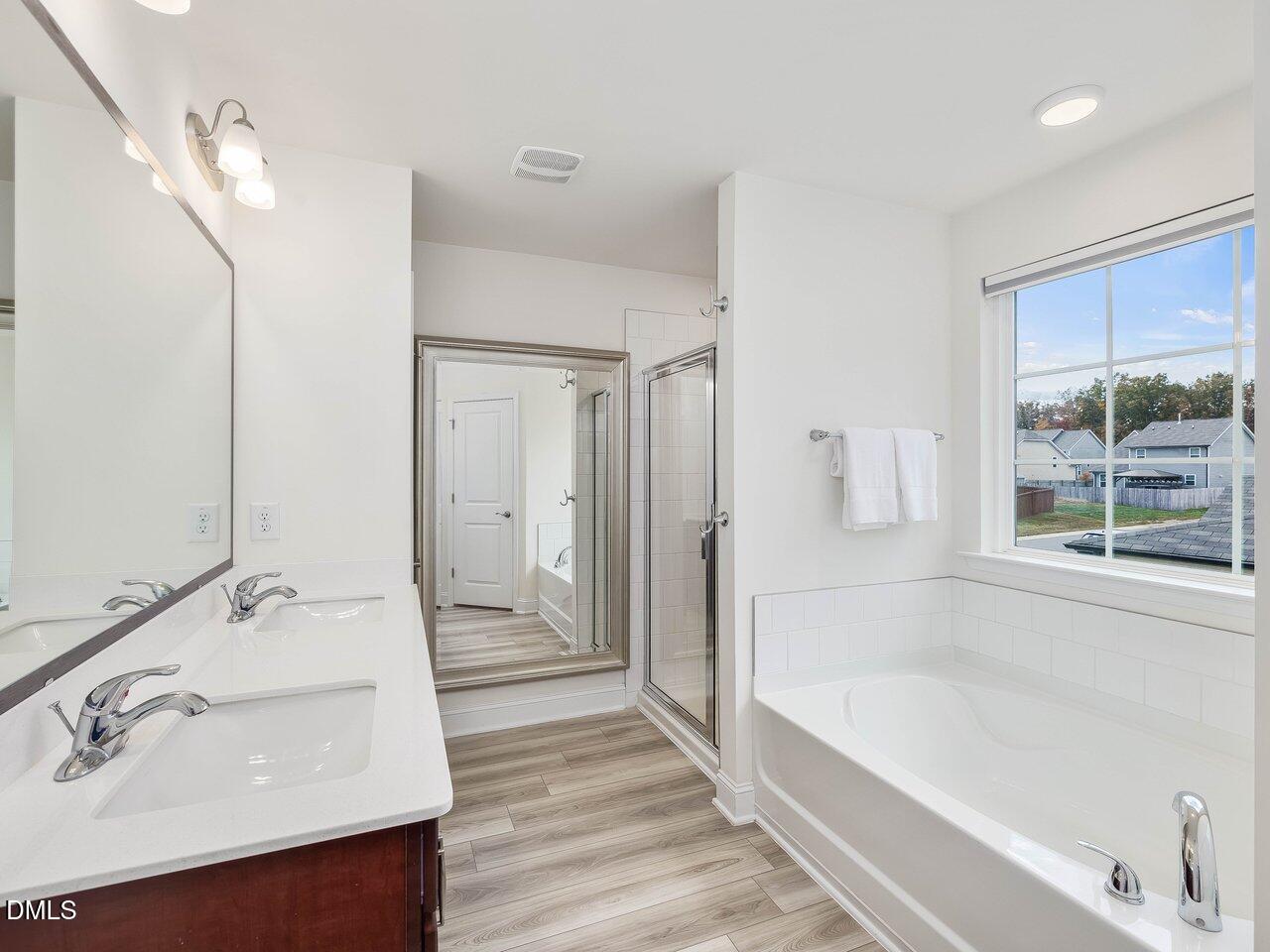 718 Heartpine Drive Mebane, NC 27302 - Photo 38 of 62 a spacious bathroom with a tub sink and mirror