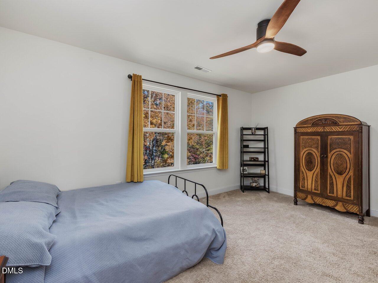 718 Heartpine Drive Mebane, NC 27302 - Photo 42 of 62 a bedroom with a bed and a large window