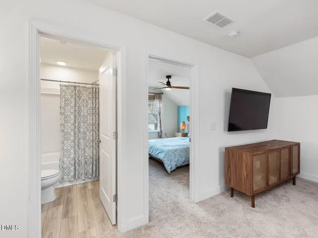 a front view of a house with a yard and a garage