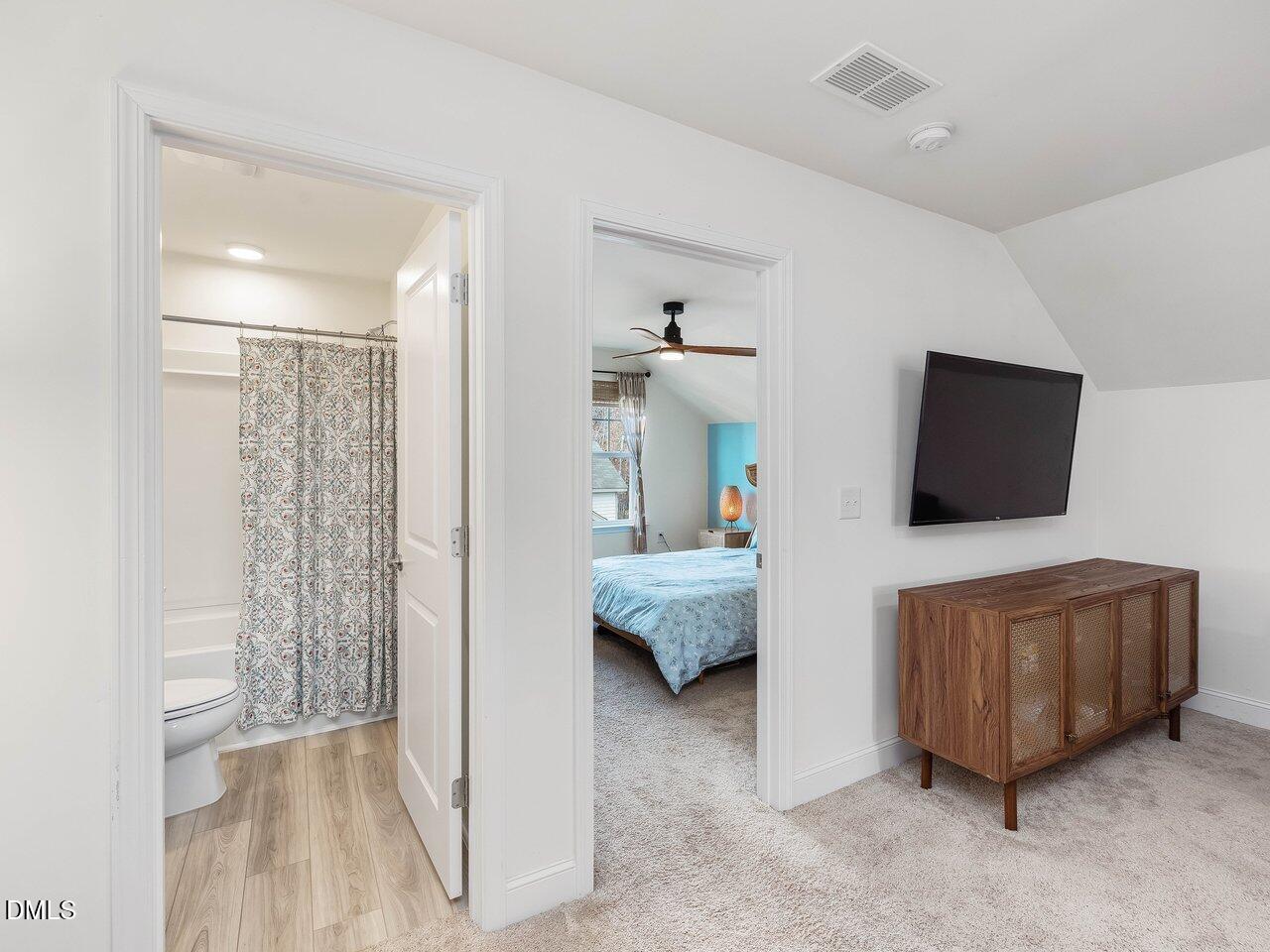 718 Heartpine Drive Mebane, NC 27302 - Photo 48 of 62 a living room with furniture and a flat screen tv