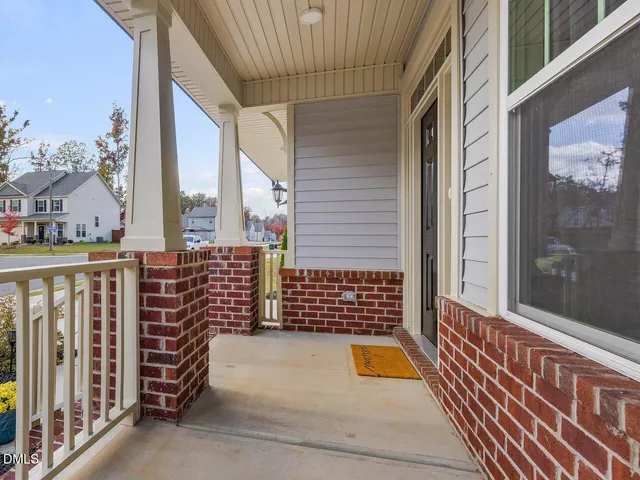a front view of a house having outdoor seating