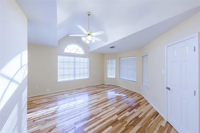 a view of an empty room with a window