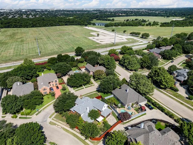 an aerial view of a city with lake view