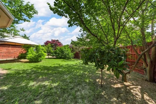 a backyard of a house with lots of green space
