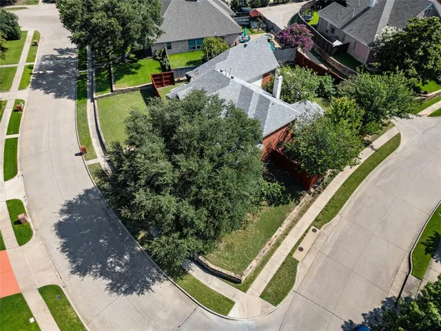 an aerial view of house with yard